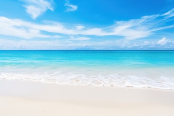 Fototapeta na wymiar a sandy beach with clear blue water and a white sand beach under a blue sky with wispy clouds.