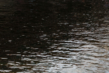 Water surface, green and white surface. Abstract triangles. River Bregalnica. Shtip, Macedonia 2024
