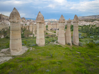 Fairy chimneys aerial view in Love Valley (Asiklar Vadisi) in Goreme Historic National Park in Cappadocia, Anatolia, Nevsehir Province, Turkey. Goreme Historic National Park is a World Heritage Site. 