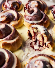 Cinnamon rolls with cherry ingredients. Mascarpone glaze
