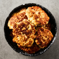  Golden Brown Chopped Chicken Cutlets or Patties with mozzarella cheese on concrete background.