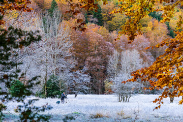 photographer working in the snow, Ordesa meadow, Ordesa i Monte Perdido National Park, Province of Huesca, Aragon