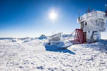 building on top of the mountain in winter