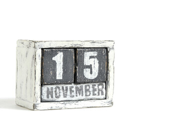 November 15 on wooden calendar, on white background.