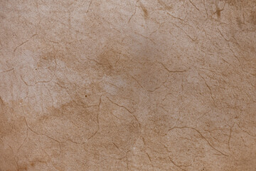 An abstract image of the texture of old faded brown leather. 