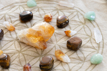 Fototapeta na wymiar A close up image of a crystal healing grid using sacred geometry and raw citrine crystals. 