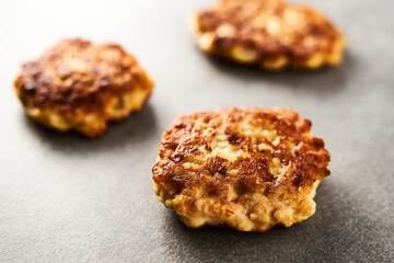  Golden Brown Chopped Chicken Cutlets or Patties with mozzarella cheese on concrete background.