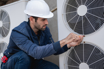 Engineers is checking the air conditioning cooling system of a major building or industrial facility. - Powered by Adobe