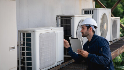 Engineers is checking the air conditioning cooling system of a major building or industrial facility. - obrazy, fototapety, plakaty