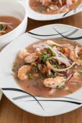served in restaurant plate of shrimp ceviche, traditional food from Ecuador, studio photo as wallpaper, healthy soup