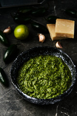 Jalapeno Pesto. Pesto made from basil leaves with jalapeno peppers, lime juice with garlic, walnuts and olive oil.