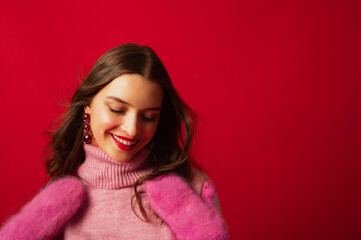 Fashionable happy smiling woman wearing trendy winter pink turtleneck sweater, warm cashmere...
