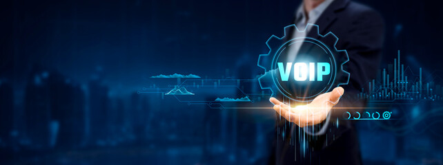Voice over Internet Protocol (VoIP). Businessman Holding Icon with Communication Solutions,...