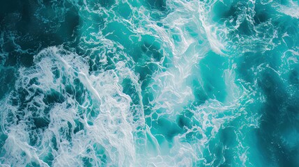 Fototapeta premium Above aerial view of turquoise ocean water with splashes