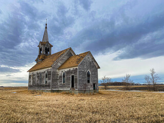 Fototapeta premium A beautiful old abandoned country church that has kept its structure intact