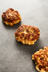  Golden Brown Chopped Chicken Cutlets or Patties with mozzarella cheese on concrete background.