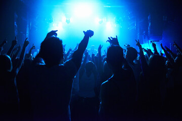 Nightclub, people and crowd with energy and lights for party, concert or rave festival with...