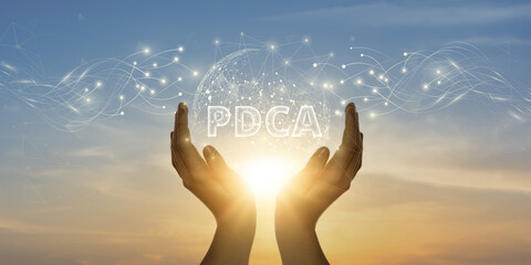 PDCA. Man Holding Global Network and Connecting Data of Plan-Do-Check-Act with Business on the...