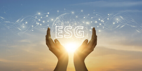ESG. Man Holding Global Network and Connecting Data of Environmental, Social, and Governance with...
