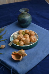 macro snails with pesto sauce photo above, snails with basil pesto, Grana Padano and pine nuts