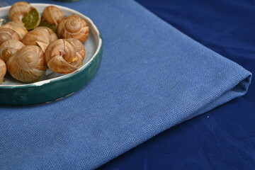 macro snails with pesto sauce photo above, snails with basil pesto, Grana Padano and pine nuts