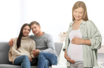 Surrogate mother and intended parents in room - obrazy, fototapety, plakaty