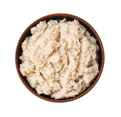 Delicious barley porridge in bowl isolated on white, top view
