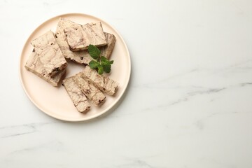 Pieces of tasty chocolate halva and mint on white marble table, top view. Space for text