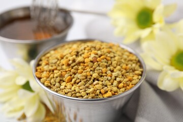 Fresh bee pollen granules on table, closeup
