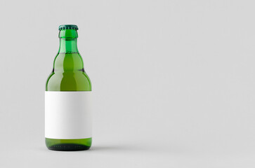 Green steinie beer bottle mockup with blank label and copyspace.