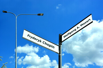 Obraz premium Street signs with names Fryderyk Chopin and Wolfgang Amadeus Mozart against the blue sky