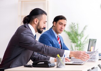 Two male colleagues in the office
