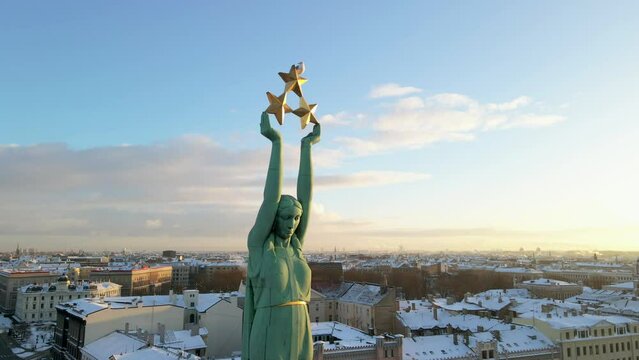 Statue of liberty Milda. The symbol of freedom of Latvia. Beautiful aerial view of Riga city - the capital of Latvia.