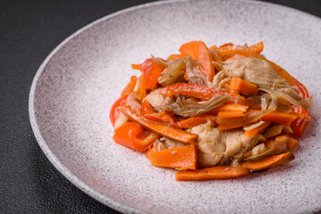 Delicious fresh stew with chicken or turkey with slices of sweet pepper and carrots