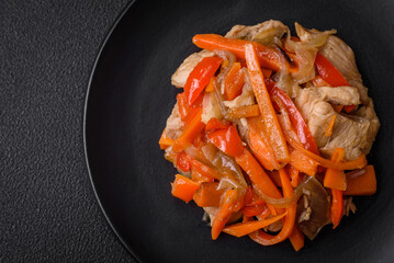Delicious fresh stew with chicken or turkey with slices of sweet pepper and carrots