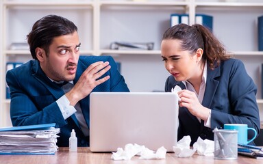Two employees suffering at workplace
