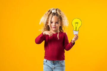 Idea Illumination. Child girl Genius with Paper Bulb.