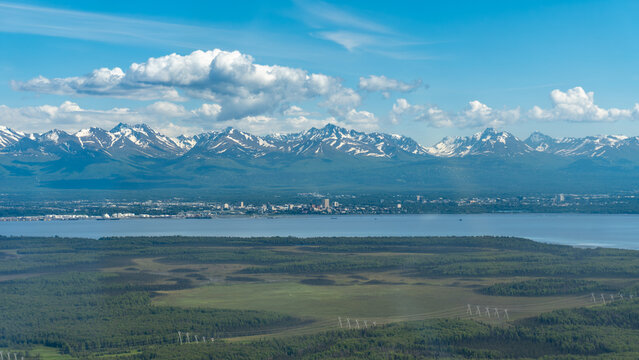 Aerial view of Anchorage, Alaska from the Point MacKenzie area. Joint Base Elmendorf - Richardson, downtown, midtown, Knik Arm, and Chugach mountains. 