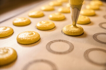 Batch of biscuits being made on kitchen countertop by professional