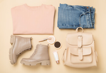 Flat lay with trendy spring outfit on color background, top view