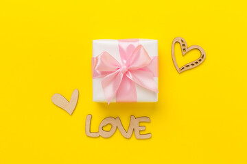 Valentines day composition with gifts on color background, top view.