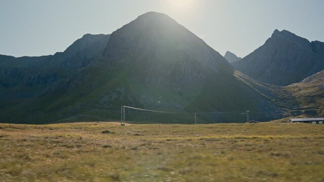 Sunlit Mountains With Telephone Poles