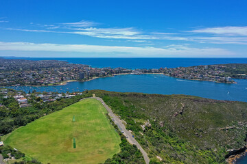 Fototapeta na wymiar High angle aerial drone view of Tania Park in the suburb of Balgowlah Heights, Sydney, New South Wales, Australia. Manly and Northern Beaches in the background.