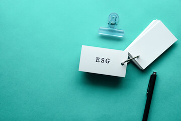 There is word card with the word ESG. It is an abbreviation for Environment, Social, Governance as...