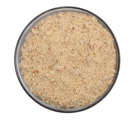 Hazelnuts ground pile in bowl isolated on white, top view