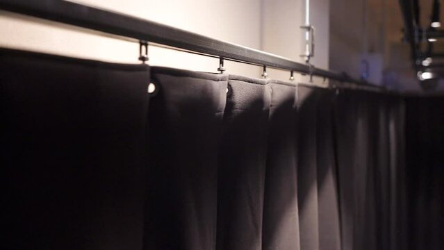 Steadicam Rotating Wide Shot of Black Draperies in the Rehearsal Hall Ceiling Tracks