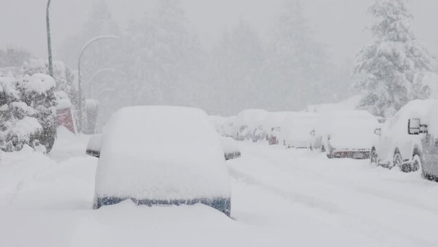 Snow Covered Cars, Road and Homes. Suburban Neighborhood. Cold Day. Snowing, Winter Season. Winter Wonderland. Burnaby, Vancouver BC Canada.