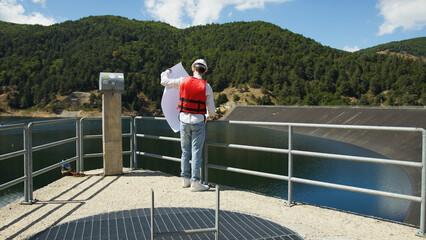 Architect checks an artificial dam