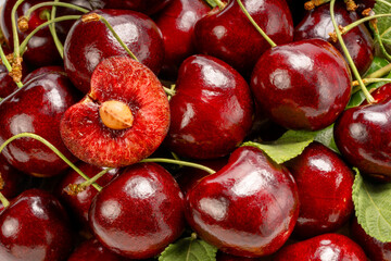 Close up shot Red Cherry in basket on wooden background.