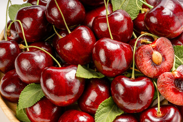 Close up shot Red Cherry in basket on wooden background.